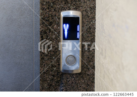 The control panel displays illuminated buttons for selecting floors in a contemporary apartment elevator setup The control panel displays illuminated buttons for selecting floors in a contemporary apartment elevator setup 122663445