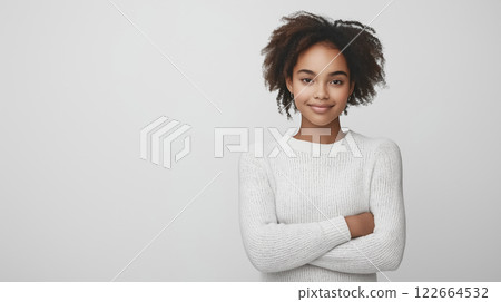 A professional studio portrait of a girl on a light plain background, expressing love and warmth with her arms wrapped around herself and a soft smile A professional studio portrait of a girl on a light plain background, expressing love and warmth with her arms wrapped around herself and a soft smile 122664532