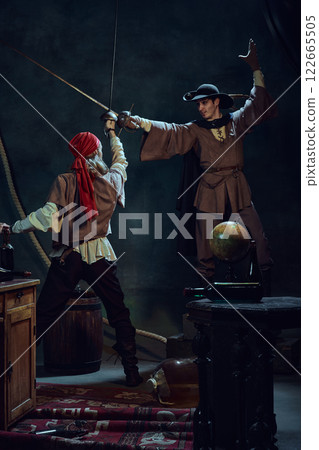 Duel of steel. Two pirates cross swords in dramatic clash against dark vintage background. 122665505