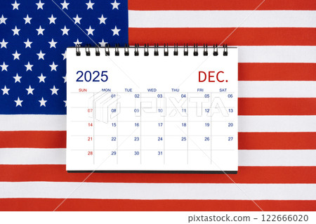 December 2025 desk calendar on United States of America flag. 122666020