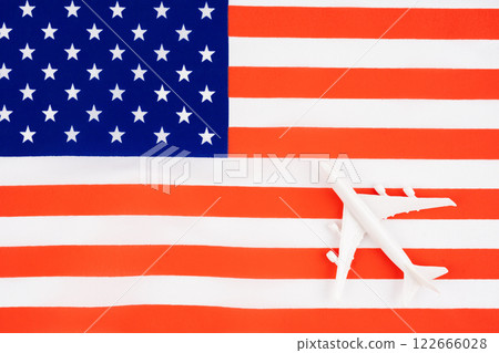 Toy airplane on flag of United States of America. Flat lay. 122666028