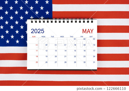 May 2025 desk calendar on United States of America flag. 122666110