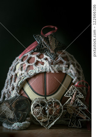 Basketball ball inside of mesh net string decoration with Christmas tree mesh case, Heart mesh case and Star mesh case. 122666386