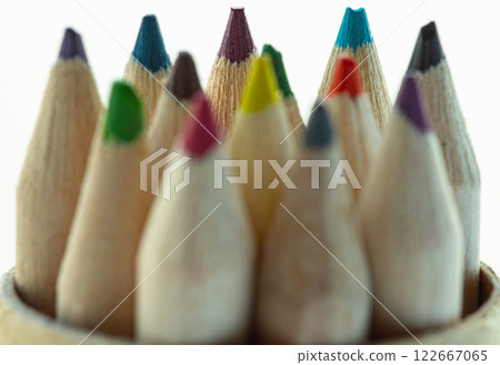 Close-up of group brown crayons or wood colors pencils with its sharpened tip facing upward. Close-up of group brown crayons or wood colors pencils with its sharpened tip facing upward. 122667065