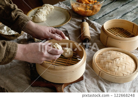 Making Asian steamed dumplings 122668248