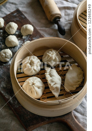 Making Asian steamed dumplings 122668249