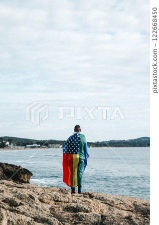 person wrapped in a rainbow US flag 122668450