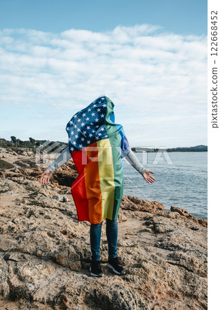 LGBTIQ person covered with a rainbow US flag LGBTIQ person covered with a rainbow US flag 122668452