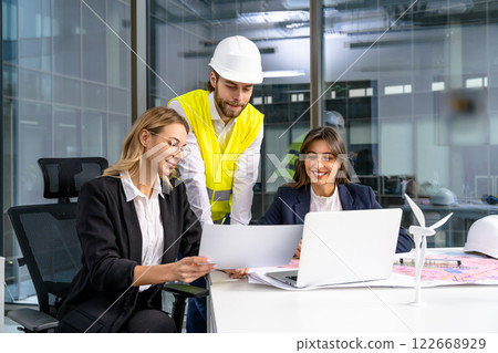 Group of people discussing new project details in the office Group of people discussing new project details in the office 122668929