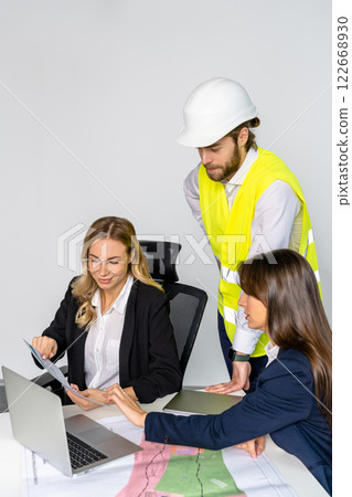 Group of people discussing new project details in the office Group of people discussing new project details in the office 122668930
