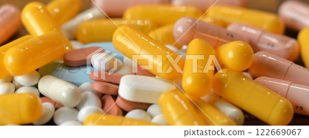 A stack of pills. Macro shot of a pile of pills, medication. Medicines in capsules. Concept of health and misuse of medicine 122669067