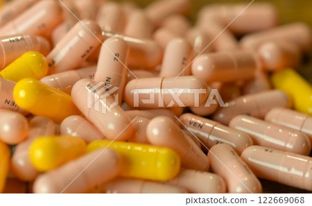 A stack of pills. Macro shot of a pile of pills, medication. Medicines in capsules. Concept of health and misuse of medicine A stack of pills. Macro shot of a pile of pills, medication. Medicines in capsules. Concept of health and misuse of medicine 122669068