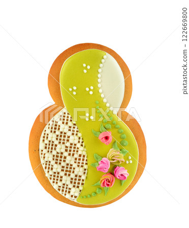 Gingerbread figure eight with flowers and caramel isolated on a white background. March 8. Women's Day. Gingerbread figure eight with flowers and caramel isolated on a white background. March 8. Women's Day. 122669800
