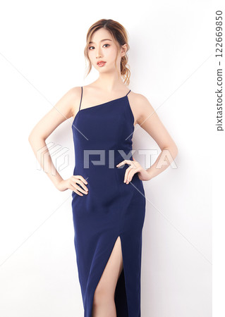 Beautiful face of young Asian woman in sexy dress Blue Perfect slim body on white background, plastic surgery and aesthetic cosmetology, Facial and skin care concept 122669850