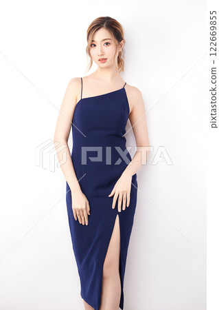 Beautiful face of young Asian woman in sexy dress Blue Perfect slim body on white background, plastic surgery and aesthetic cosmetology, Facial and skin care concept Beautiful face of young Asian woman in sexy dress Blue Perfect slim body on white background, plastic surgery and aesthetic cosmetology, Facial and skin care concept 122669855