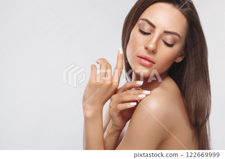Portrait of female hands with manicure nails. Care for hands and nails and cosmetics. Copyspace. Portrait of female hands with manicure nails. Care for hands and nails and cosmetics. Copyspace. 122669999