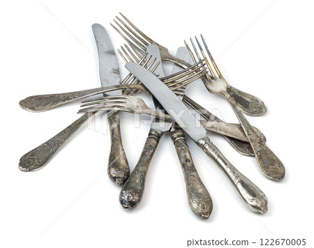 vintage antique silver forks and knives piled together. High quality photo 122670005