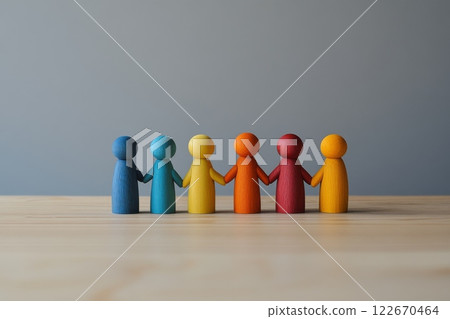 Wooden Figures. A row of colorful human figures stand together, symbolizing of diversity. Importance of inclusion, teamwork. People Silhouettes. Concepts of unity in our society. Humanity. Copy Space Wooden Figures. A row of colorful human figures stand together, symbolizing of diversity. Importance of inclusion, teamwork. People Silhouettes. Concepts of unity in our society. Humanity. Copy Space 122670464