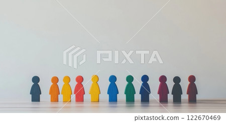 Wooden Figures. A row of colorful human figures stand together, symbolizing of diversity. Importance of inclusion, teamwork. People Silhouettes. Concepts of unity in our society. Humanity. Copy Space 122670469