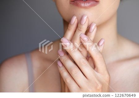 Beautiful Young Woman With Healthy Skin And Manicure. Woman Natural Makeup And Care For Hands Cosmetics. Manicure And Hands Spa. Cosmetology, Beauty. Skin Care Beautiful Young Woman With Healthy Skin And Manicure. Woman Natural Makeup And Care For Hands Cosmetics. Manicure And Hands Spa. Cosmetology, Beauty. Skin Care 122670649