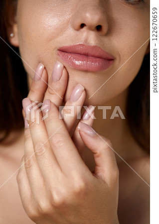 Beautiful Young Woman With Healthy Skin And Manicure. Woman Natural Makeup And Care For Hands Cosmetics. Manicure And Hands Spa. Cosmetology, Beauty. Skin Care Beautiful Young Woman With Healthy Skin And Manicure. Woman Natural Makeup And Care For Hands Cosmetics. Manicure And Hands Spa. Cosmetology, Beauty. Skin Care 122670659