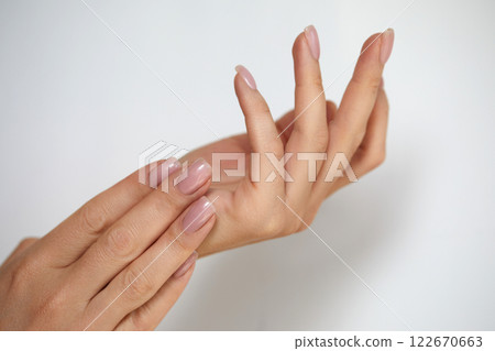Beautiful Woman hand closeup. Manicure and Hands Spa. Manicured nails and Soft hands skin. Cosmetology, beauty. Skin care Beautiful Woman hand closeup. Manicure and Hands Spa. Manicured nails and Soft hands skin. Cosmetology, beauty. Skin care 122670663