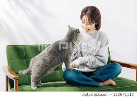 A woman living with a cat A woman living with a cat 122671118