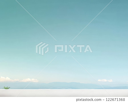 Serene landscape view with clear sky and distant mountains during daylight hours 122671368