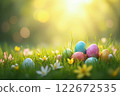 Colorful Easter Eggs in a Sunny Meadow Surrounded by Flowers and Greenery During Springtime Festivities 122672535