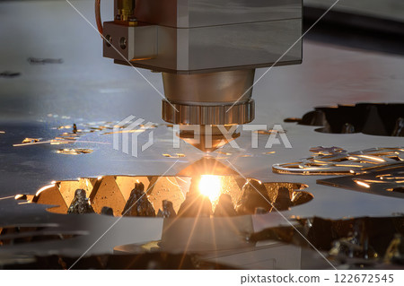 The fiber laser cutting machine  cut the metal plate with the sparkling light. 122672545