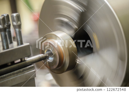 The lathe machine bore cutting the metal shaft parts. The lathe machine bore cutting the metal shaft parts. 122672548