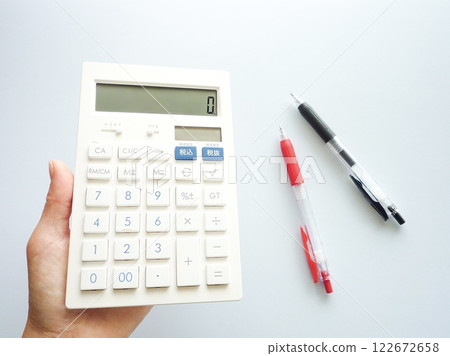 Calculator and ballpoint pen Calculator and ballpoint pen 122672658