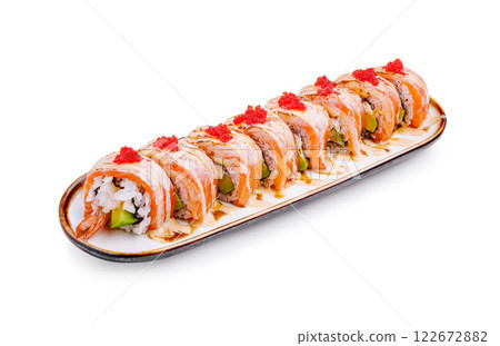 Sushi platter featuring colorful rolls garnished with vibrant toppings served on a sleek plate Sushi platter featuring colorful rolls garnished with vibrant toppings served on a sleek plate 122672882