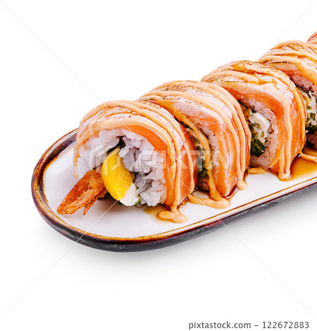 Delicious sushi roll with salmon, shrimp, and avocado served on a white plate with drizzled sauce Delicious sushi roll with salmon, shrimp, and avocado served on a white plate with drizzled sauce 122672883