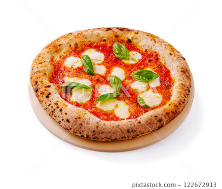 Delicious margherita pizza with fresh basil leaves served on a wooden plate 122672913