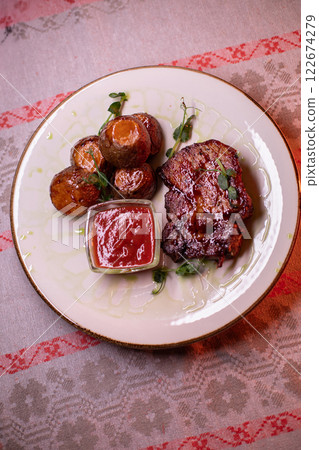 Beautiful restaurant dish golden potatoes and 122674279