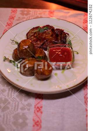 Beautiful restaurant dish golden potatoes and 122674282