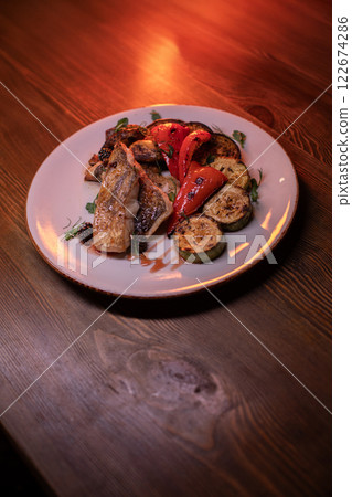 Restaurant dish fish with vegetables: zucchini 122674286