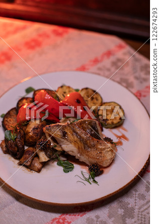 Restaurant dish fish with vegetables: zucchini 122674293