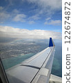 Rainbow and airplane wing 122674872