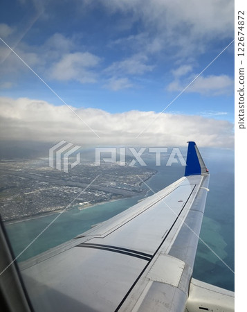 Rainbow and airplane wing 122674872