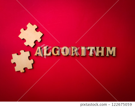 Closeup wooden word and wooden puzzle with the word ALGROITHM on a red background. Closeup wooden word and wooden puzzle with the word ALGROITHM on a red background. 122675059