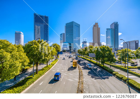 Yokohama cityscape in Japan. View of buildings including Sakuragicho Station, City Hall, and the landmark reflected in Kitanaka. Redevelopment of Kannai Station in the background. 122676087