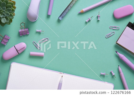 Stationery frame in purple pastel colors on a mint green background. Space for your text. Stationery frame in purple pastel colors on a mint green background. Space for your text. 122676166