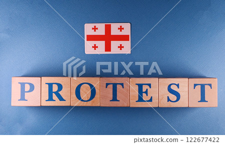 The inscription is made of wooden cubes. Protests are taking place in Georgia against the background of violations in the parliamentary elections. The inscription is made of wooden cubes. Protests are taking place in Georgia against the background of violations in the parliamentary elections. 122677422
