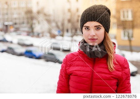 Woman wearing winter clothes outside Woman wearing winter clothes outside 122678076