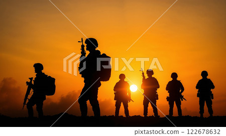 Military squad standing with rifles at sunset 122678632