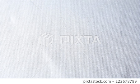 White fabric texture background showing soft wrinkles and gentle lighting 122678789