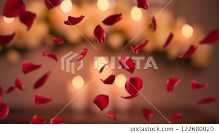 Rose petals falling down against the background of burning candles 122680020