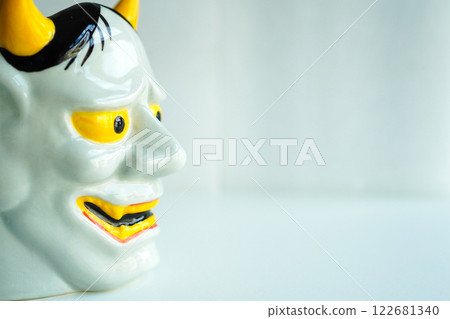 Profile of a ceramic Hannya statue - Copy space 122681340